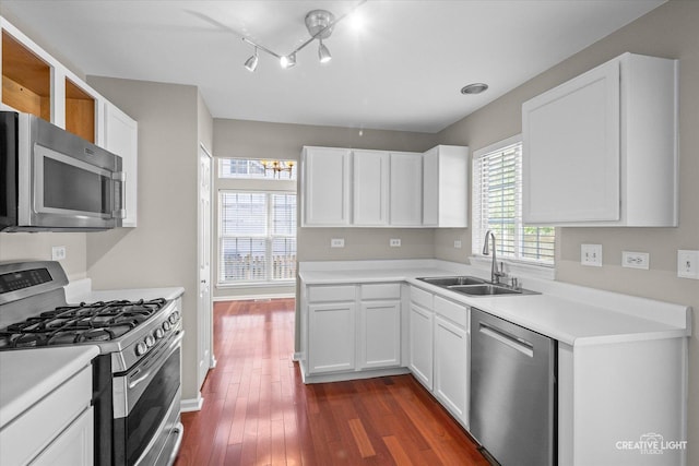 1207 Pennsbury Ln, Aurora, IL 60502 - kitchen featuring stainless steel appliances, a sink, white cabinets, and dark wood-style flooring