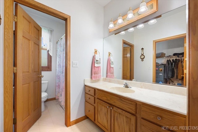 46W306 Woodview Pkwy, Hampshire, IL 60140 - full bathroom with toilet, vanity, a spacious closet, and baseboards