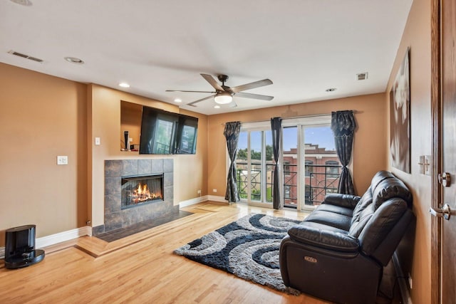 5652 W 63rd St Unit 3E, Chicago, IL 60638 - living area with visible vents, a ceiling fan, baseboards, and wood finished floors