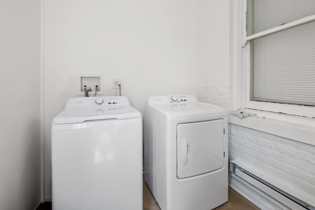 3237 W Cortez St, Chicago, IL 60651 - washroom with washing machine and clothes dryer, laundry area, baseboard heating, and wood finished floors