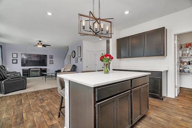 1825 Spencer Way, Shorewood, IL 60404 - kitchen featuring ceiling fan with notable chandelier, open floor plan, light countertops, and dark wood-style floors