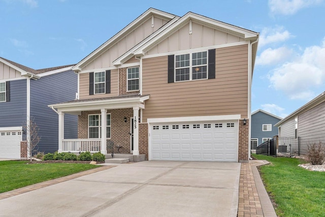 1825 Spencer Way, Shorewood, IL 60404 - view of front of home featuring a porch, fence, brick siding, and board and batten siding