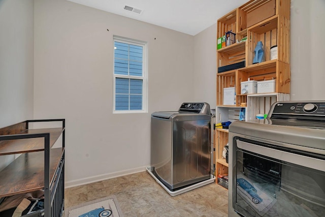 1825 Spencer Way, Shorewood, IL 60404 - laundry area featuring baseboards, laundry area, separate washer and dryer, and visible vents
