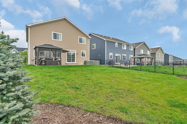 1825 Spencer Way, Shorewood, IL 60404 - back of property with a fenced backyard, a gazebo, and a lawn