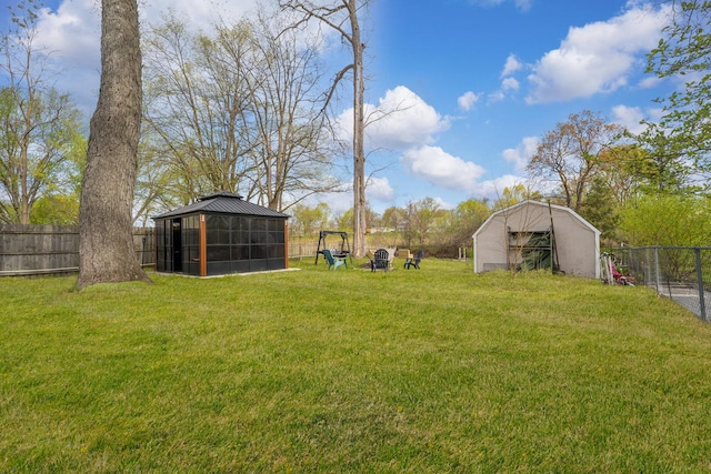 26312 W Blackhawk Ave, Ingleside, IL 60041 - view of yard with a fenced backyard, a gazebo, an outdoor structure, and a shed