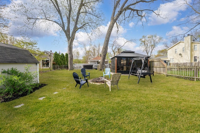 26312 W Blackhawk Ave, Ingleside, IL 60041 - view of yard featuring a fenced backyard, a gazebo, and a fire pit