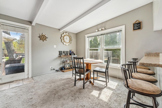 26312 W Blackhawk Ave, Ingleside, IL 60041 - dining space with baseboards, lofted ceiling with beams, visible vents, and carpet