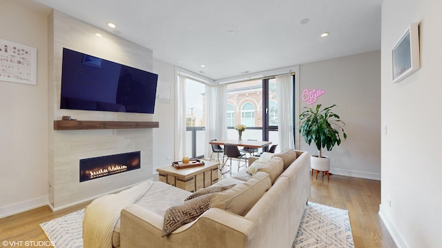 1350 N Claremont Ave Unit 2, Chicago, IL 60622 - living area with wood finished floors, a fireplace, baseboards, and recessed lighting