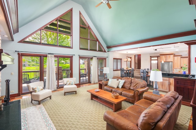 living room featuring a ceiling fan, high vaulted ceiling, and wood finished floors