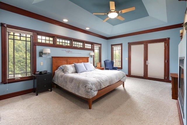 carpeted bedroom with baseboards, multiple windows, and ceiling fan