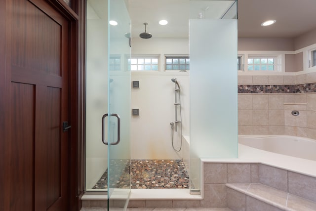 full bathroom featuring a stall shower, recessed lighting, and a bath
