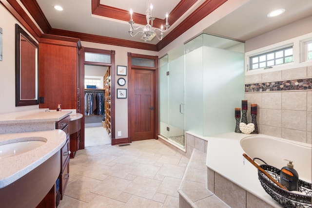 bathroom featuring a garden tub, crown molding, vanity, a stall shower, and a notable chandelier