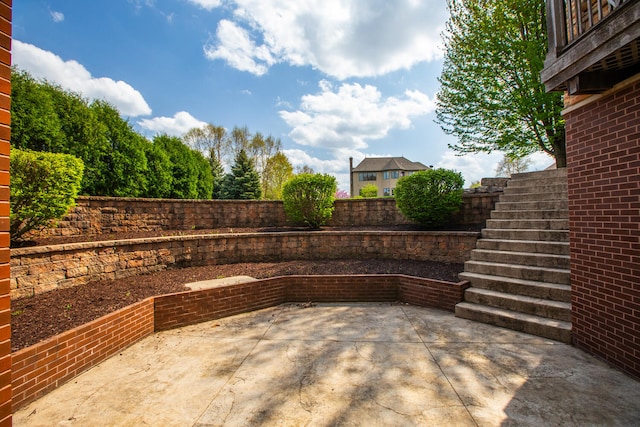 view of patio / terrace with a fenced backyard and stairway