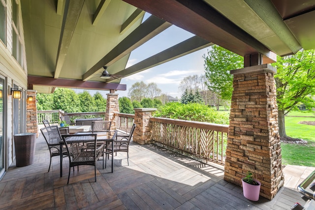 wooden deck with central AC and outdoor dining area