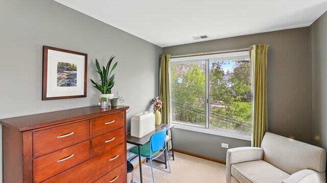 sitting room featuring baseboards, light carpet, and visible vents