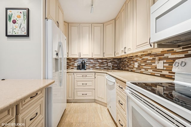 901 S Plymouth Ct Unit 104, Chicago, IL 60605 - kitchen featuring white appliances, cream cabinetry, light countertops, and backsplash