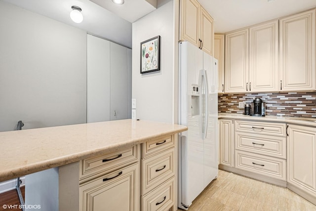 901 S Plymouth Ct Unit 104, Chicago, IL 60605 - kitchen with cream cabinets, white refrigerator with ice dispenser, tasteful backsplash, and recessed lighting