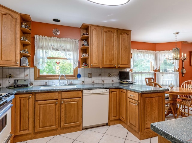 kitchen with white dishwasher, open shelves, a sink, and a peninsula