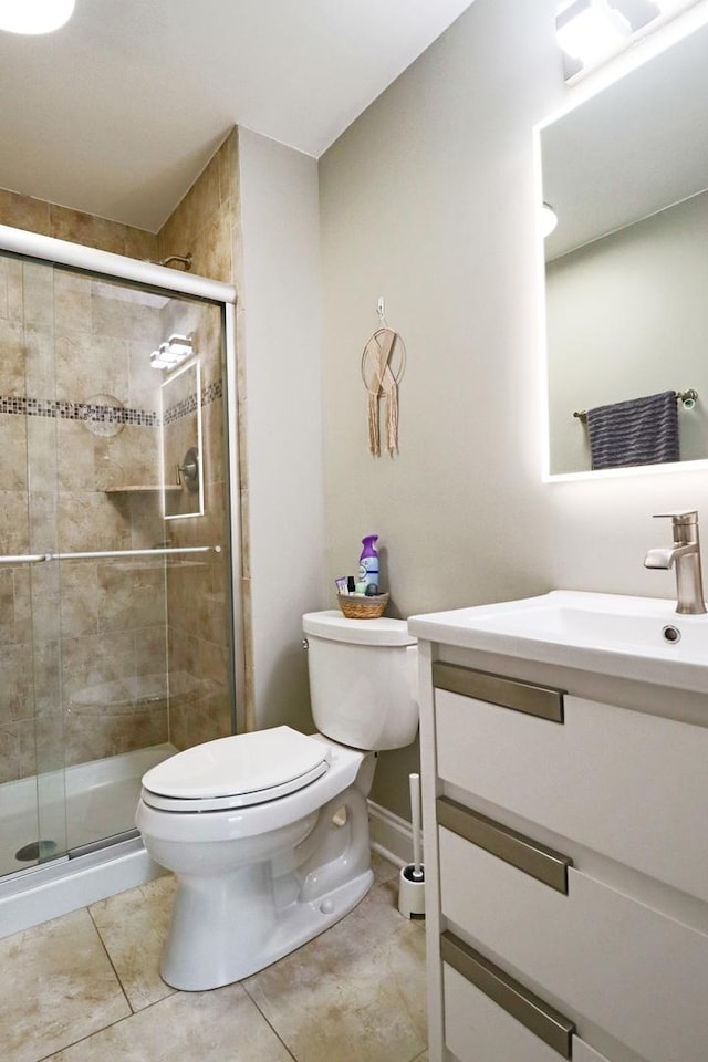 full bath with vanity, tile patterned flooring, a stall shower, and toilet