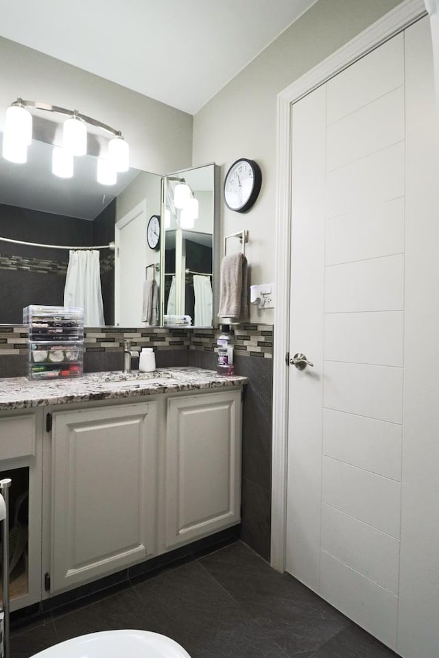 full bathroom featuring vanity, decorative backsplash, tile patterned flooring, tile walls, and a shower with curtain