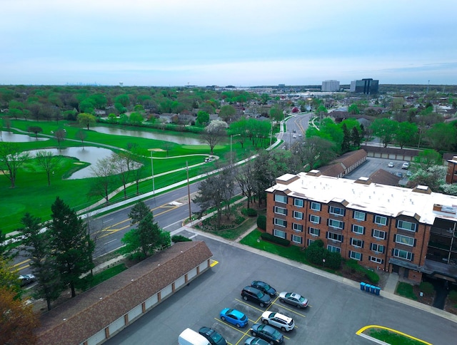 birds eye view of property featuring a water view and golf course view