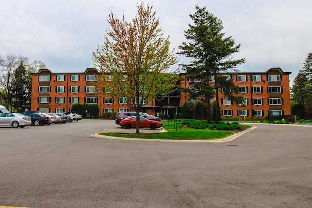 view of property with uncovered parking