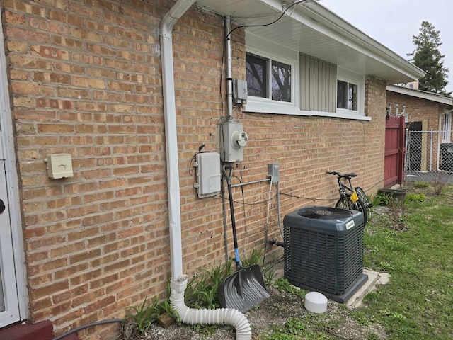 3109 Sussex Ave, Markham, IL 60428 - view of home's exterior featuring brick siding, fence, and cooling unit