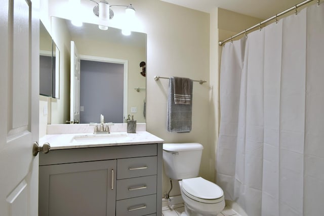 bathroom featuring toilet, a shower with curtain, and vanity