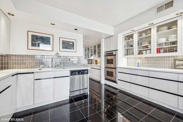 2314 N Lincoln Park W Unit 8-9S, Chicago, IL 60614 - kitchen featuring light countertops, stainless steel appliances, white cabinetry, and visible vents