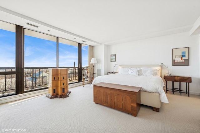 2314 N Lincoln Park W Unit 8-9S, Chicago, IL 60614 - bedroom with light carpet and a wall of windows
