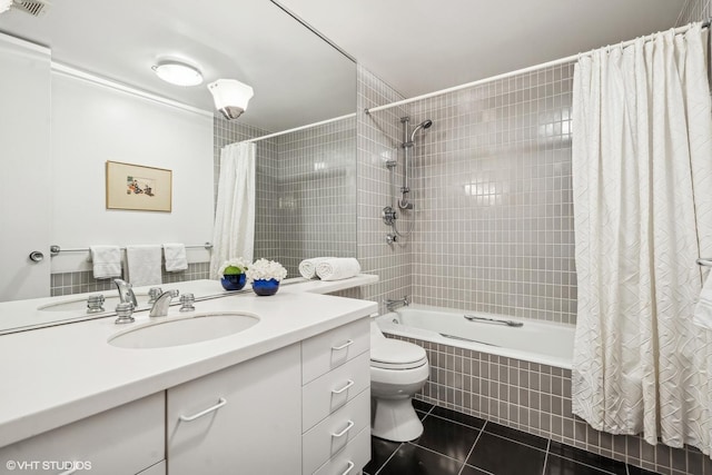 2314 N Lincoln Park W Unit 8-9S, Chicago, IL 60614 - full bathroom featuring tile patterned flooring, vanity, toilet, tiled shower / bath combo, and visible vents