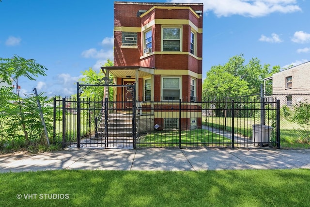 7422 S Kimbark Ave, Chicago, IL 60619 - view of front of house featuring brick siding, a fenced front yard, and a gate