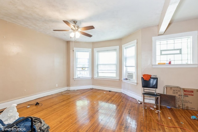7422 S Kimbark Ave, Chicago, IL 60619 - unfurnished room featuring baseboards, hardwood / wood-style flooring, a ceiling fan, and cooling unit