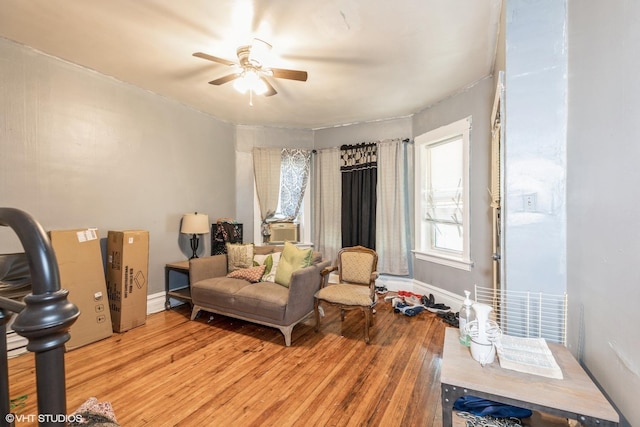7422 S Kimbark Ave, Chicago, IL 60619 - living room with light wood-style floors, a ceiling fan, and baseboards