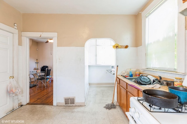 7422 S Kimbark Ave, Chicago, IL 60619 - kitchen with light floors, white gas range, and light countertops