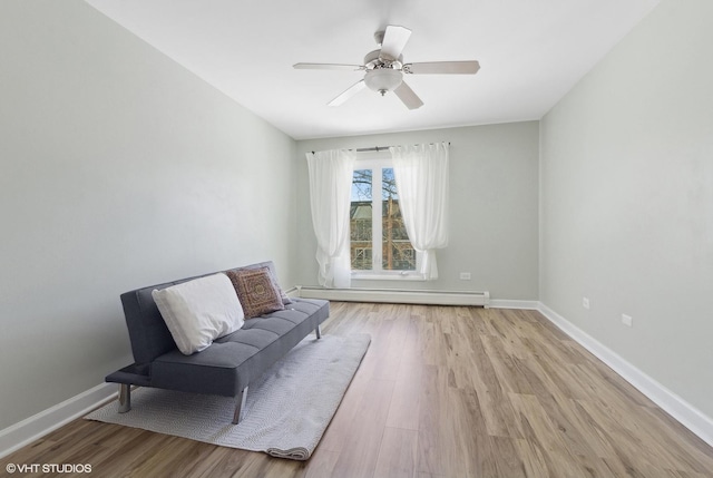 4250 Saratoga Ave Unit 301, Downers Grove, IL 60515 - sitting room with a ceiling fan, baseboards, light wood-style flooring, and a baseboard radiator