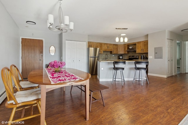 4250 Saratoga Ave Unit 301, Downers Grove, IL 60515 - dining room with an inviting chandelier, baseboards, electric panel, and dark wood finished floors