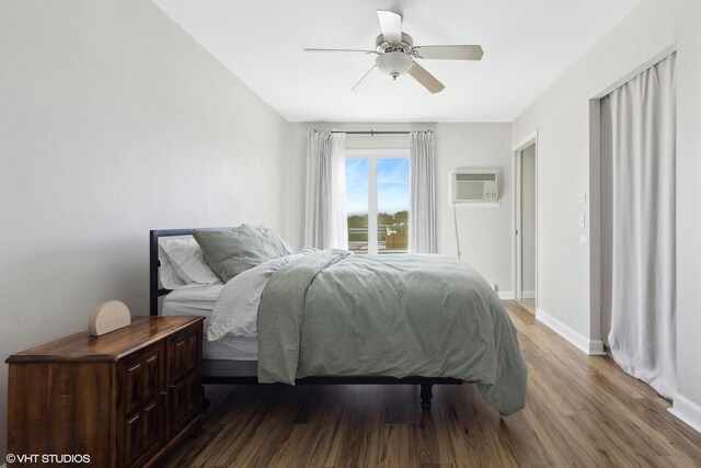 4250 Saratoga Ave Unit 301, Downers Grove, IL 60515 - bedroom with baseboards, a wall mounted air conditioner, a ceiling fan, and wood finished floors