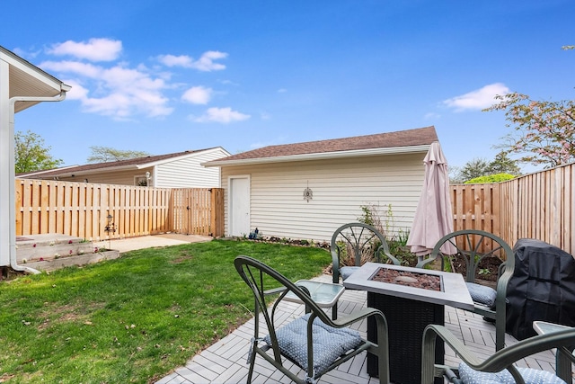 view of patio / terrace featuring a fenced backyard and a fire pit