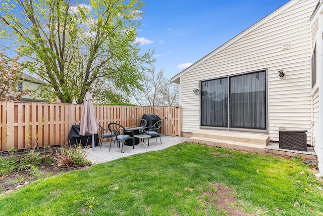 view of yard featuring a patio and a fenced backyard
