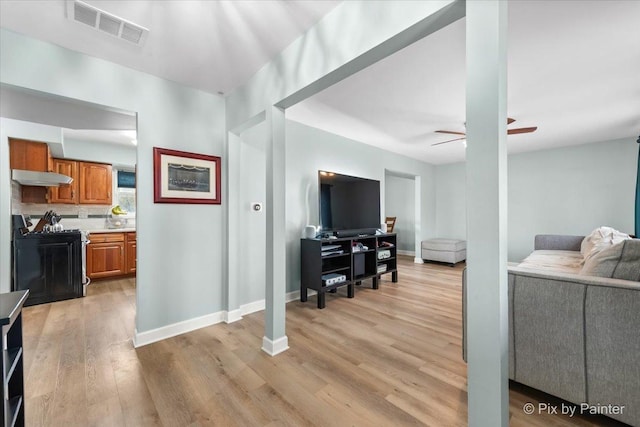 8015 S Carrolton Ct, Hanover Park, IL 60133 - living area featuring baseboards, a ceiling fan, visible vents, and light wood-style floors