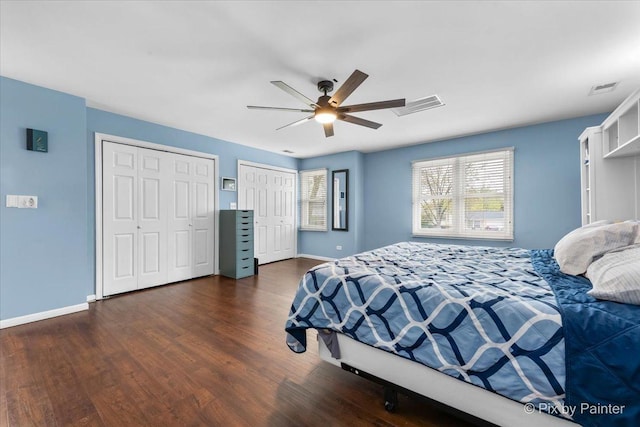 8015 S Carrolton Ct, Hanover Park, IL 60133 - bedroom featuring dark wood finished floors, multiple windows, two closets, and visible vents
