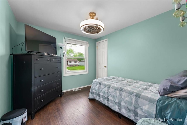 8015 S Carrolton Ct, Hanover Park, IL 60133 - bedroom featuring a closet, wood finished floors, visible vents, and baseboards