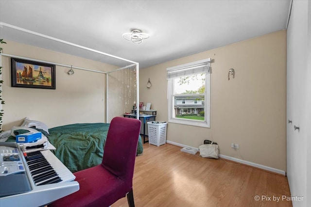8015 S Carrolton Ct, Hanover Park, IL 60133 - bedroom with baseboards, a closet, and wood finished floors