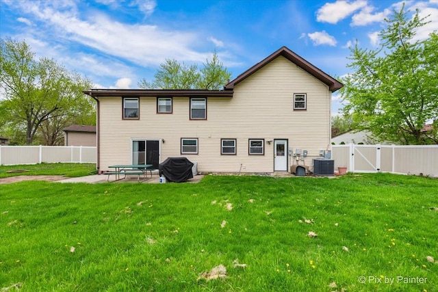 8015 S Carrolton Ct, Hanover Park, IL 60133 - rear view of property with a patio, a gate, a lawn, and a fenced backyard
