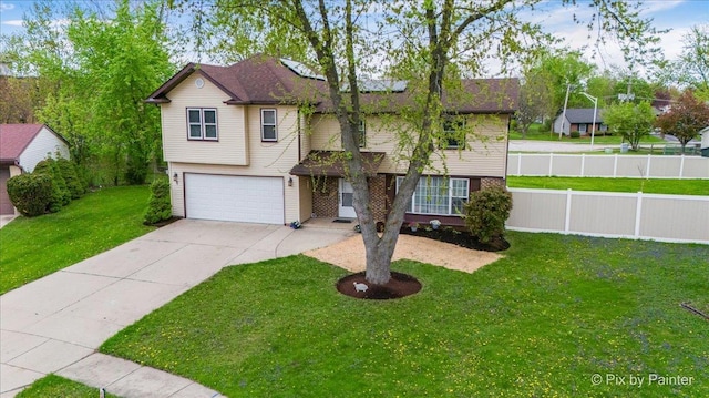 8015 S Carrolton Ct, Hanover Park, IL 60133 - view of front facade with fence, an attached garage, a front lawn, and driveway
