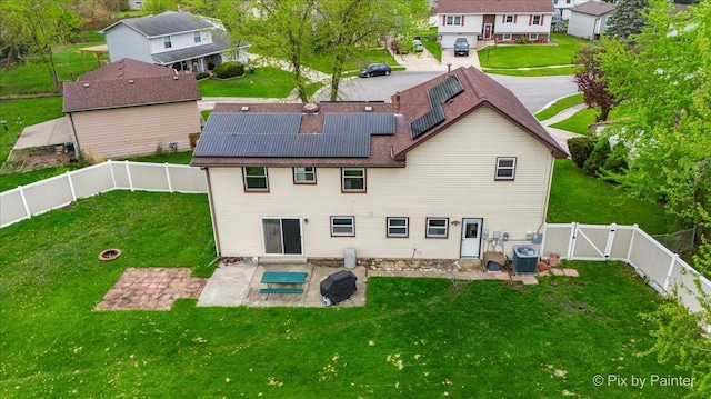 8015 S Carrolton Ct, Hanover Park, IL 60133 - rear view of house featuring a gate, central AC, a patio, a fenced backyard, and solar panels