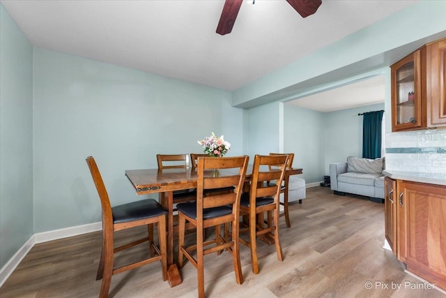 8015 S Carrolton Ct, Hanover Park, IL 60133 - dining room with baseboards, light wood-style flooring, and ceiling fan