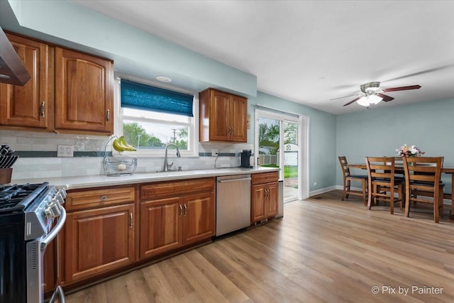 8015 S Carrolton Ct, Hanover Park, IL 60133 - kitchen featuring backsplash, brown cabinets, light countertops, and stainless steel appliances