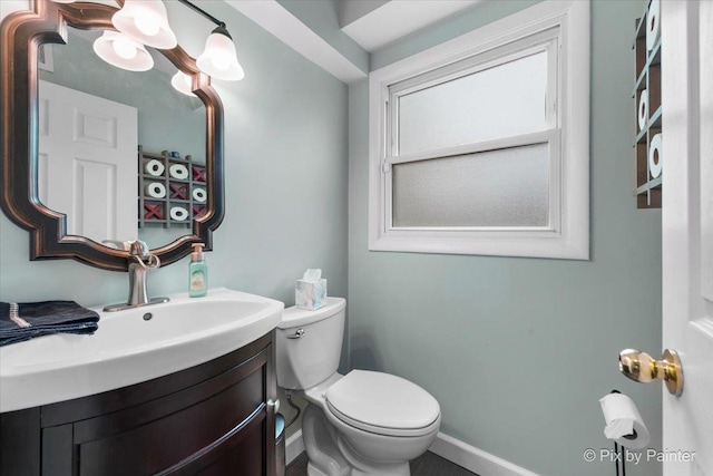 8015 S Carrolton Ct, Hanover Park, IL 60133 - half bathroom with toilet, baseboards, and vanity